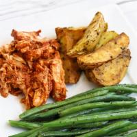Bbq Chicken & Potatoes · Hand-shredded chicken breast with house bbq sauce paired with herb-roasted Yukon potato wedg...