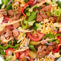 Steak & Cheese (140 Cals) · Philly-style steak‡ mixed with onion and green peppers, topped with melted American-style ch...