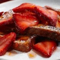 Strawberry French Toast · Three slices of French toast with strawberries.