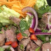 Num Tok Salad · Medium spicy. Grilled beef tossed in spicy with lime dressing, mint, red onion, scallion and...