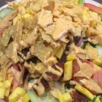 Mango Blackened Chicken Salad · Spring mix, tomatoes, cucumbers, red onions, corn, tortilla chips, mango strips and chipotle...