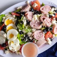 Chef Salad · Romaine lettuce, ham, turkey, provolone, tomatoes, onions and hard boiled egg. Served with b...