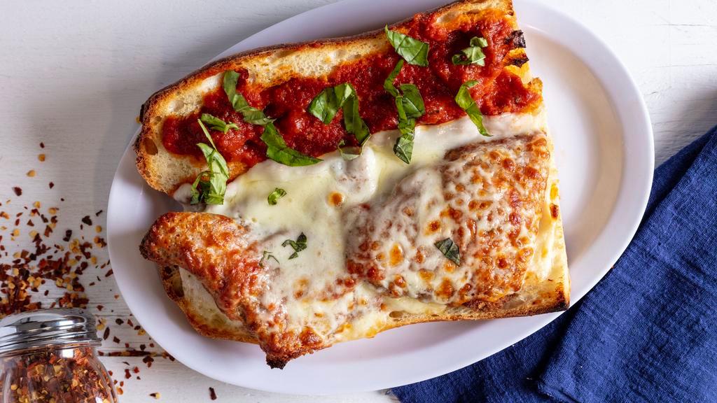 Chicken Parmigiana Sub · Served with fries.