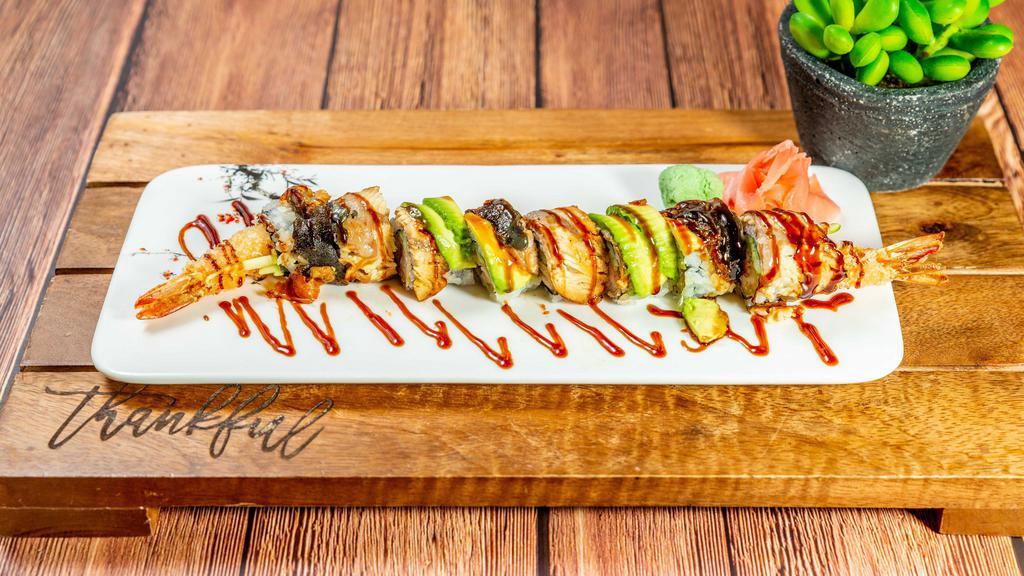Black Dragon Roll · Shrimp tempura inside, topped with eel and avocado.
