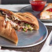 Meat Lovers Stromboli · Stromboli filled with Pepperoni, Sausage, Bacon, Beef, and Mozzarella Cheese. Comes with a s...
