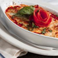 Lasagna · Our signature dish. Our home-made pasta sheets stuffed with 4 layers of Ricotta Cheese, Grou...