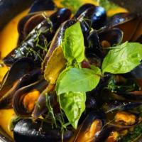 Pattaya Mussels · Spicy, Gluten-free. Black mussel, Thai basil, onion, cherry tomato, lemongrass, spicy lemong...