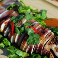Spicy Whole Squid · Grilled whole Surume Ika squid, spicy tamarind-garlic sauce, sesame