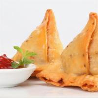 Samosa · classic arabic and indian appetizer. a fried or baked pastry stuffed with potatoes,peas,lent...