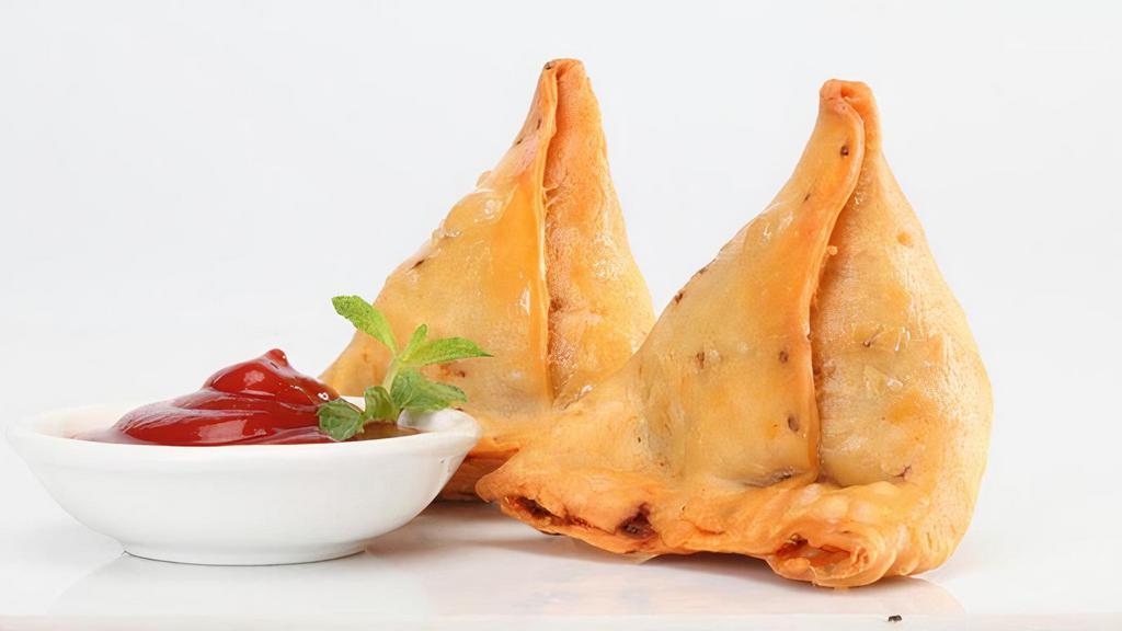 Samosa · classic arabic and indian appetizer. a fried or baked pastry stuffed with potatoes,peas,lentils etc