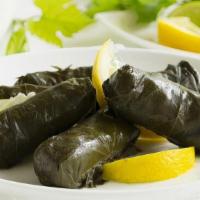 Dolma · grape leaves stuffed with rice, tomatoes,onion,parsley,slowly cooked with lemon juice and he...