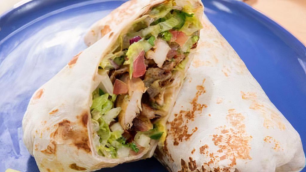 Chicken Shawarma Wraps · marinared chicken chopped and grilled ,and in pita bread with lettuce, tomatoes, cucumbers,pickles, ,feta cheese.  Served with signature white sauce and red sauce.