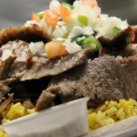 Gyro  Plate Over Rice · tender lean lamb and beef meat sliced and grilled  over spiced basmati rice and side salad. ...