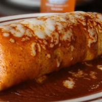 Portales Burrito · Steak or chicken, rice and beans all inside! Covered with enchilada sauce 
and cheese