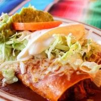 Burritos Mexicanos · Two burritos, beef tips & beans, topped w/lettuce, tomato, 
Sour cream & guacamole