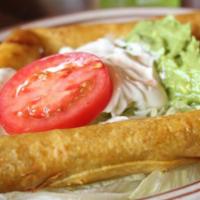 Taquitos Mexicanos · Fried corn taquitos, (two beef, two chicken) served with lettuce, tomato, 
Sour cream & guac...