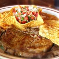Cazuelon · Tender rib eye, & grilled chicken seerved with rice
beans, and pico de gallo