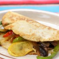 Quesadilla Vegetarian · Grilled mix vegetables inside of flour tortilla with melted cheese.