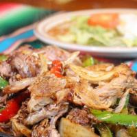 Fajitas Pork · chunks of pork with grilled onions, bell pepper, tomatoes, mushrooms. Served with beans, 
sa...