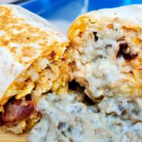 Sausage Gravy Breakfast Burrito · Cracked Eggs, sausage, bacon, hand shredded hashbrowns, cheddar and smoked gouda cheeses, dr...