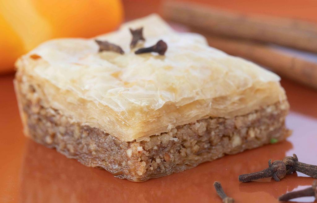 Baklava (Everyone'S Favorite) · Rich Sweet pastry that is hand layered with phyllo dough filled with almonds, walnuts. cinnamon, sugar and spices. Baked to a crispy golden perfection, finished with Mamma Greek's homemade syrup.