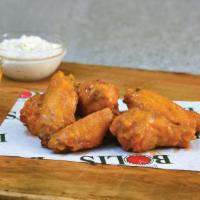 Buffalo Wings · Trays of thirty wings. Your choice of two flavors per tray.