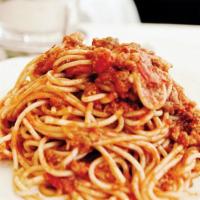 Spaghetti Pasta · On top mozzarella cheese and served with crispy garlic bread.
