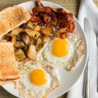 Breakfast 2 · Two eggs with bacon or sausage, home fries and toast.