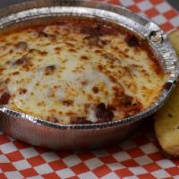 Meat Lasagna · Layers of mozzarella cheese, beef, and sausage with our signature marinara sauce. Served wit...