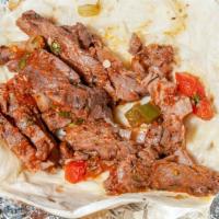Zoomys Beef Fajita Taco · Marinated steak fajita grilled to perfection with roasted poblano peppers, grilled onions, t...