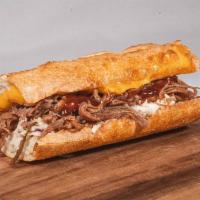 #17 Bbq Brisket · Thin-sliced smoked Brisket, topped with BBQ Sauce, Cheddar Cheese & a house-made Jalapeno Ra...