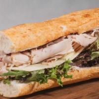 #15 Cranberry Turkey · Thinly sliced Turkey topped with our Cranberry Sauce, with your choice of produce, Dijon and...