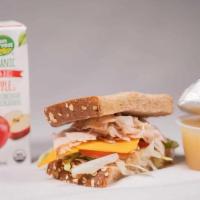 Kids Sandwich Meal · A sliced Honey Wheat bread half sandwich, built to liking! Served with Applesauce & Choice o...