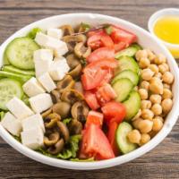 A Really Good Chopped Salad · Romaine lettuce, tomatoes, mozzarella cheese, cucumbers, garbanzo beans, green olives, red w...