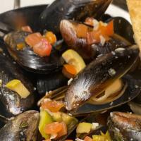 Sautéed Mussels · Sautéed in white wine with garlic and shallots, served with crostini.
