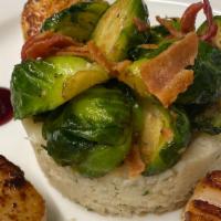 Scallops · Four Jumbo scallops placed over a delicate cauliflower rice, accompanied with brussel sprout...