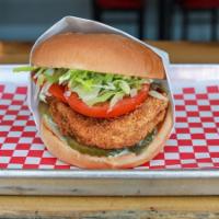 Crispy Chicken Sandwich* · Homemade Golden Crispy Chicken Breast Topped with Lettuce, Tomato, Pickle and Mayo on a toas...