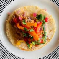 Carnitas Taco Classic · Braised Pork, Salsa de Arbol, Onion, Cilantro