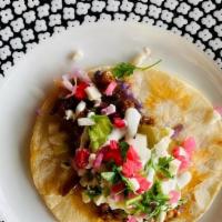 Chorizo Taco · Spicy Mexican Chorizo, Guacamole, Salsa Arriera, Crema, Queso Fresco