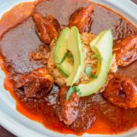 Camarones A La Diabla · Shrimp served with a side of Mexican rice, topped with spicy red diablo sauce and avocado.