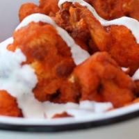 Buffalo Cauliflower · Lightly fried cauliflower florets covered in Mama's wing sauce. Served with a side of ranch ...