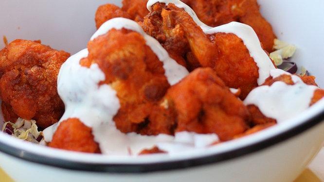 Buffalo Cauliflower · Lightly fried cauliflower florets covered in Mama's wing sauce. Served with a side of ranch dressing.