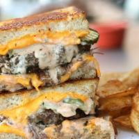 All-American Beach Melt · Over one lb of handmade char-grilled patties and melted all-American cheese on toasted sourd...