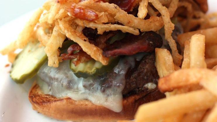Boston'S Bbq Burger · Char-grilled choice beef, Mama's homemade BBQ sauce, stacked with onion strings, smoked bacon, Pepper Jack cheese and pickle.
