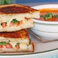 Homemade Tomato Basil Bisque 'N Tomato Basil Grilled Cheese Sam-Wich · Homemade bisque, grilled sourdough with Cheddar and mozzarella, fresh basil and sliced tomat...