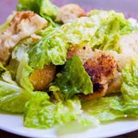 Caesar Salad · Romaine lettuce, Italian herbed croutons, Parmesan cheese.