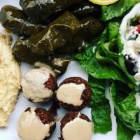 Mediterranean Combo Plate · Grape leaves, falafel, and hummus served with greek salad.