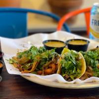 Street Tacos · Your choice of meat served with cilantro, onion, and salsa on the side.