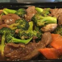 Beef And Broccoli · Stir fried sliced beef, broccoli, carrots & mushrooms served in a brown sauce