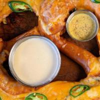 Jalapeno Cheddar Jack Pretzel · Giant Munich Pretzel stuffed with jalapenos and cheddar jack cheese. served with beer cheese...